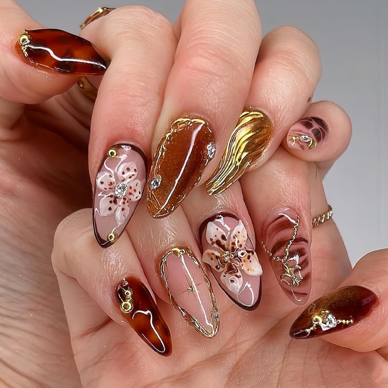 SEENEEY Medium Almond Press on Nails Brown Fake Nails Floral Artificial Nail with Gold Charm Designs Glitter Stick on Nail for Women 24pcs - Image 1